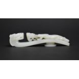 A Chinese White Jade Chi Dragon Belt Buckle, 13cms Wide