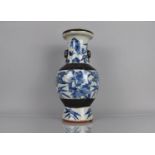 A 19th Century Blue and White Crackle Glazed Vase decorated with Dragons Amongst Foliage an Flowers,