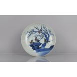 A 19th Century Chinese Blue and White Porcelain Charger decorated with Swallows Perched on