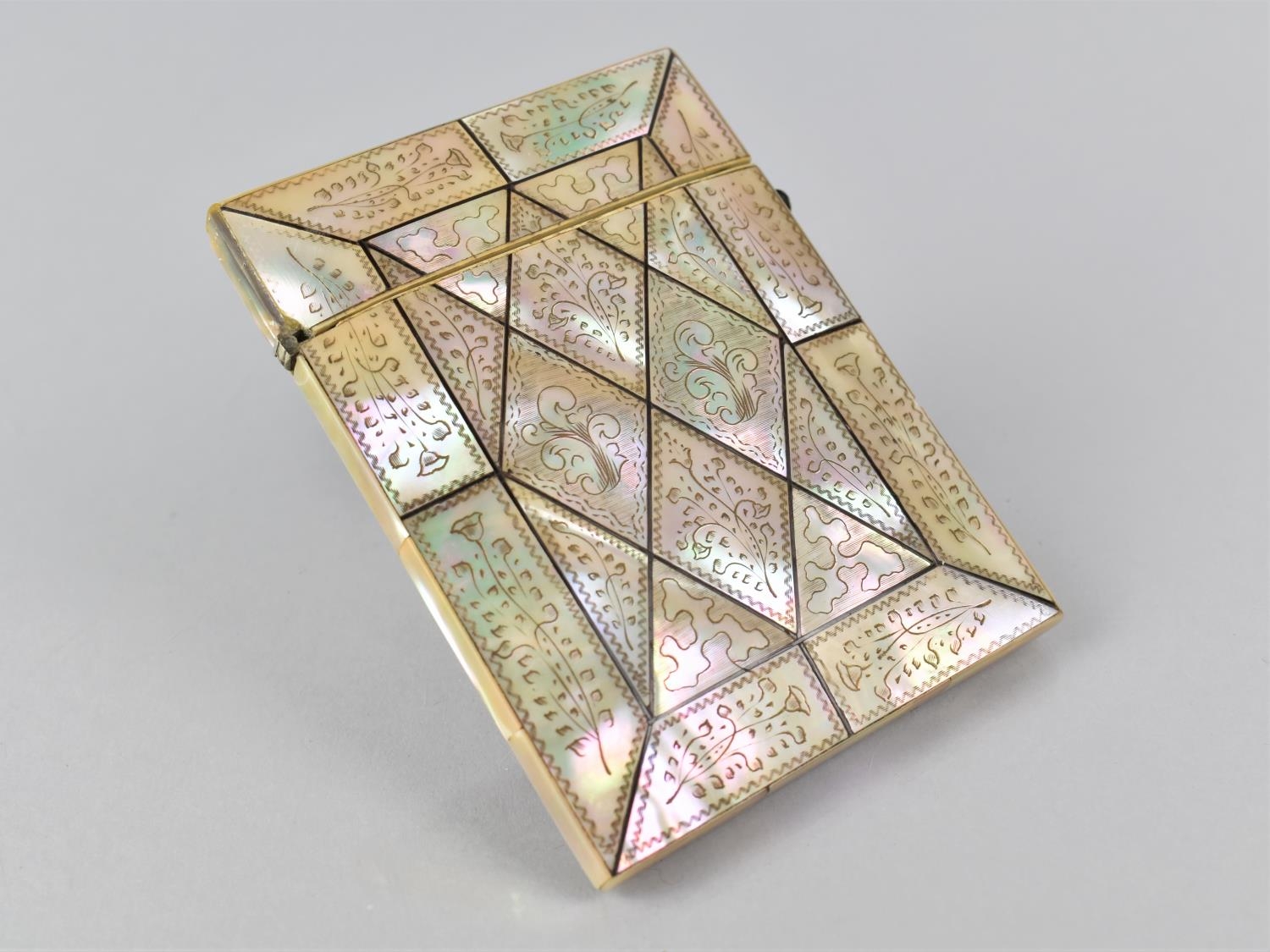 A 19th Century Mother of Pearl Card Case with Engraved Decoration, 11x8cms