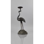A Japanese Bronze Candlestick in the Form of Crane Holding Lily Sprig with Candle Holder in Beak and