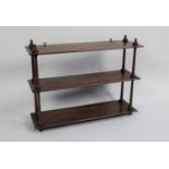 A Late Victorian Mahogany Wall Hanging Three Tier Shelf Unit with Turned Supports, 62cms Wide