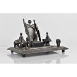 A 19th Century Indian Carved Ebony Ink Stand with Turned Inkwells, Pen Rests, Watch Holder and