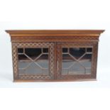 A Mahogany Shelved and Glazed Cabinet with Blind Carved Geometric Decoration, 93cms Wide