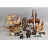 A Collection of Various Treen Ornaments to include Souvenir African Busts, Antelope, Ships Etc