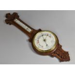 An Edwardian Oak Framed Aneroid Wheel Barometer