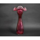 A Large Victorian Cranberry Glass Vase with Handkerchief Cuff Top Having Opaque Trails , 45cms High