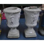 A Pair of Reconstituted Stone Garden planters Decorated in Relief with Maidens of Classical Style,