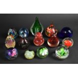 A Collection of Various Coloured Glass Paperweights