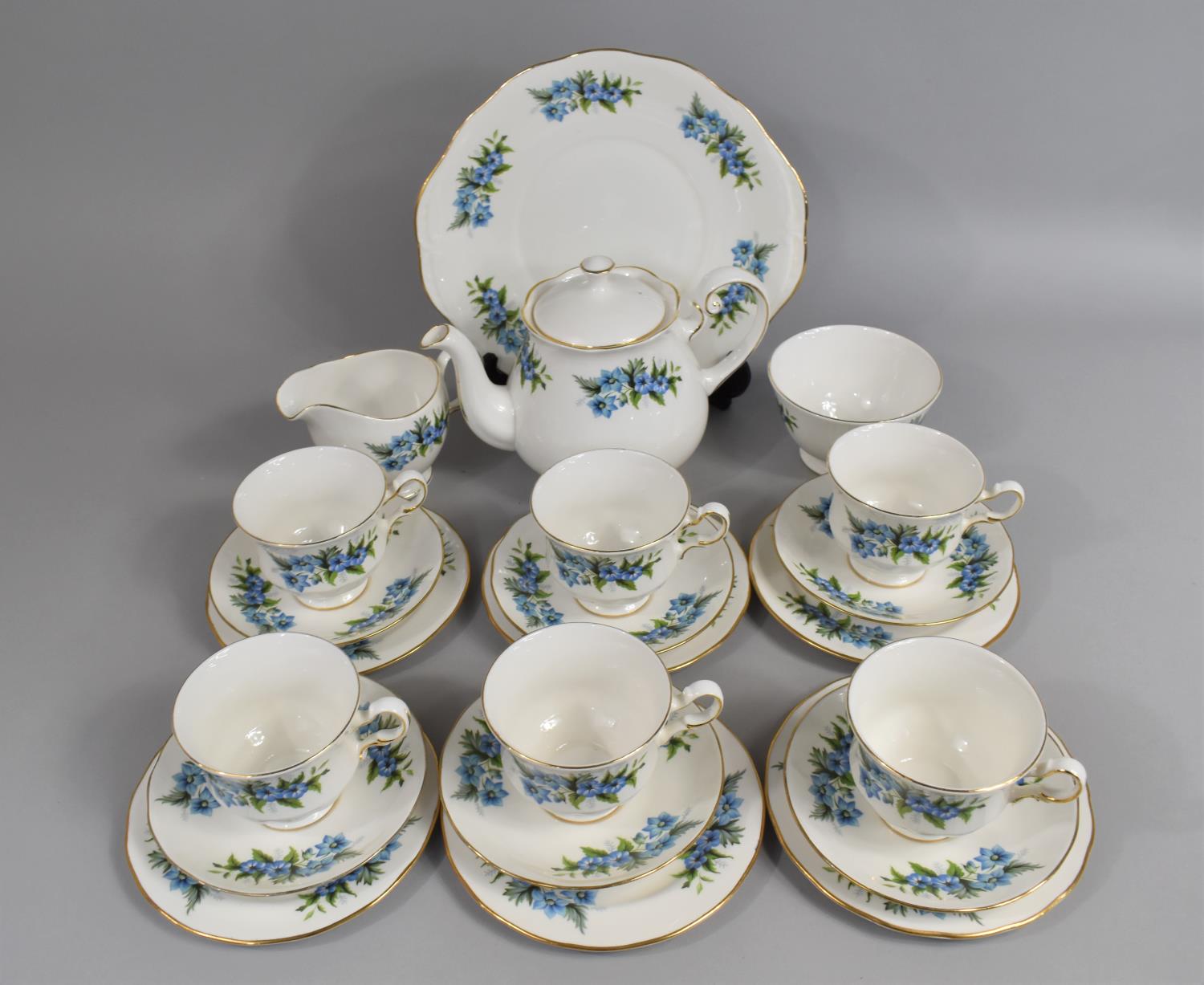 A Queen Anne Floral Decorated Tea Set to comprise Cups, Saucers, Side Plates, Teapot Etc