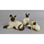 Three Beswick Siamese Cat Ornaments
