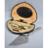 A Vintage Cased Tortoiseshell Ladies Manicure Set, together with a Silver Plated Cake Slice