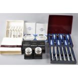 A Collection of Various Cased Cheese Knives, Ceramic Handled Teaspoons, Wedgwood Napkin Rings and