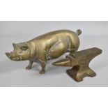 A Vintage Metal Desk Top Advertising Paperweight together with a Heavy Brass Model of a Pig, 20cms