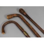 A Vintage Wooden Puzzle Ball Stick, two Other Walking Sticks
