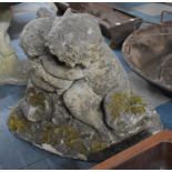 A Reconstituted Stone Garden Ornament, Cherubs Embracing, Naturalistic Base, 48cms High