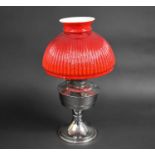 A Ind 20th Century Chromed Aladdin Oil Lamp with Opaque Red Glass Shade, 45cms High