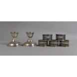 A Pair of Silver Dwarf Candlesticks, Birmingham Hallmark Together with a Set of Five White Metal
