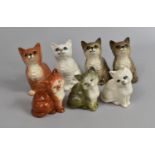 A Set of Four and a Set of Three Smaller Beswick Cat Ornaments