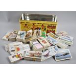 A Decorated Tin Containing Quantity of Cigarette Cards