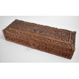 An Intricately Carved Oriental Rectangular Box, Hinged Lid with Dragons and Scrolled Foliate