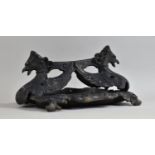 A Cast Iron Boot Scraper in the Form of Winged Griffin on Scrolled Rectangular Base, Possibly