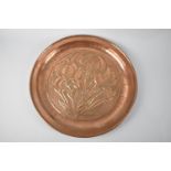 A Circular Arts and Crafts Copper Tray Decorated with Irises and Stamped For the Keswick School of