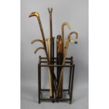 A Vintage Eight Division Stick Stand Containing Large Quantity of Walking Sticks and Umbrella to