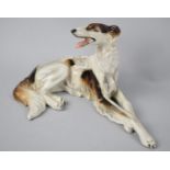 A Continental Study of a Reclining Afghan Hound, 25cm Wide