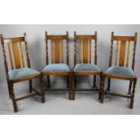 A Set of Four Oak Framed Barley Twist Dining Chairs