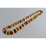 A Graduated Amber Faceted Necklace