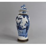A Chinese Nanking Crackle Glazed Baluster Vase and Cover Decorated with Figures in Garden Setting,