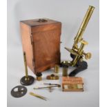An Early 20th Century Brass Microscope with Accessories, Spare Lenses and Mahogany Carrying Case