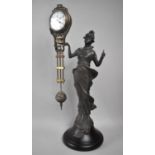 A Reproduction Bronze Figural Mystery Clock, Working, 34cms High