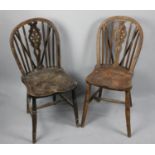 A Pair of Elm Seated Wheel Back Chairs