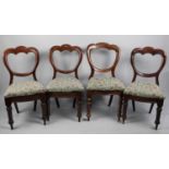 A Set of Four Victorian Mahogany Framed Balloon Back Dining Chairs with Tapestry Seats