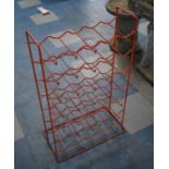 A Red Painted Seven Tier Bottle Rack
