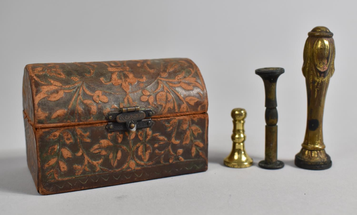 An Edwardian Leather Covered Dome Topped Box Containing Three Seals, 8cm wide