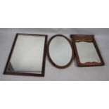 A Collection of Three Various Shaped Mirrors