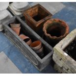 A Collection of Various Terracotta Garden Plant Pots and a Rectangular Trough Planter