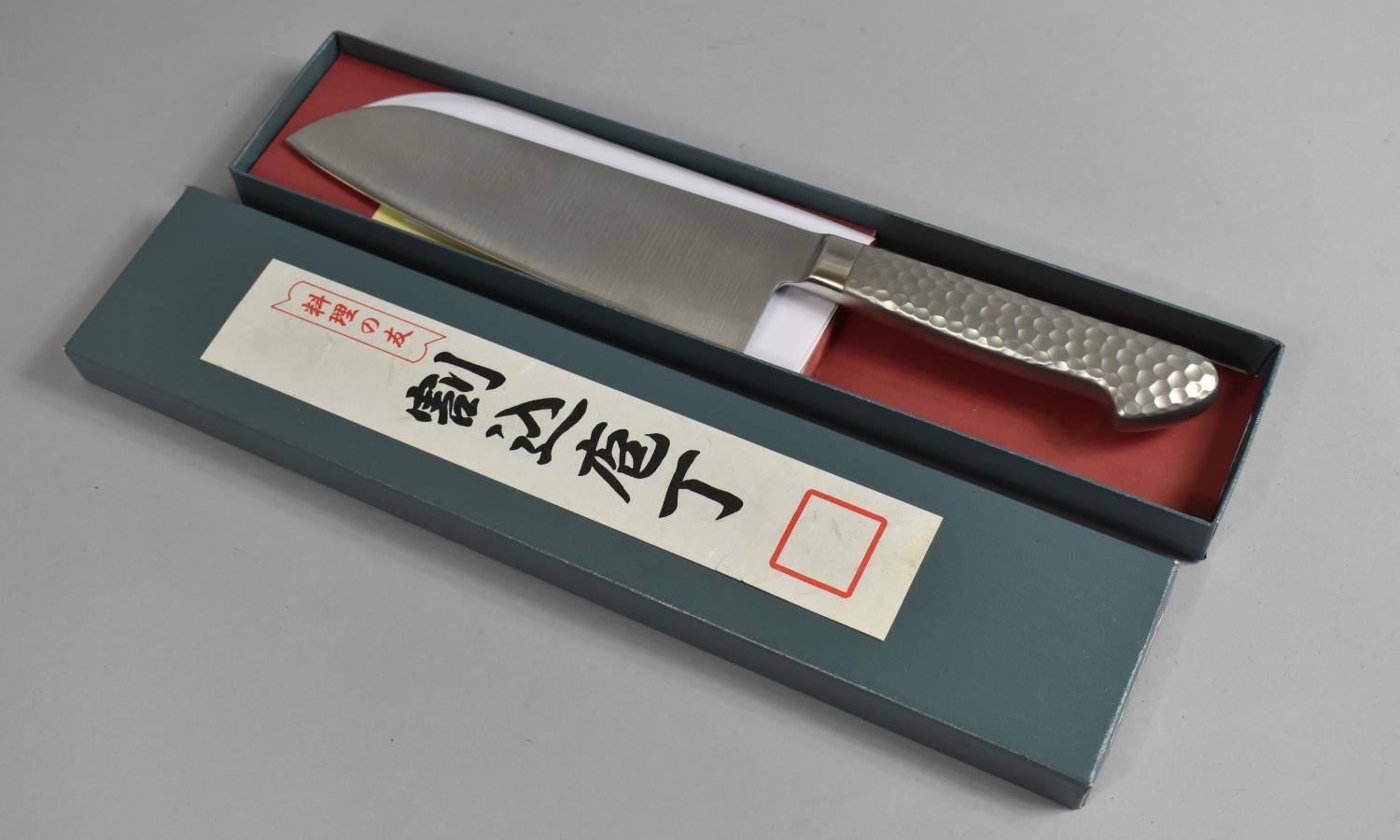 A Contemporary Oriental Chefs Knife with Hammered Pewter Handle