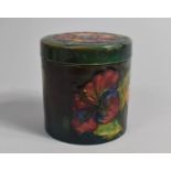 A Moorcroft Lidded Pot of Cylindrical Form, Impressed Mark to Base, Floral Decoration on Green