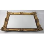 A Mid 20th Century gilt framed rectangular wall mirror, 63 x 47 cm overall.