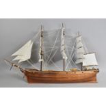 A Large Wooden Model of a Three Masted Gun Boat in Full Sale, 97cms Long