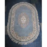 A Chinese Oval Woollen Rug, 154x95cms