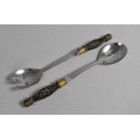 A Pair of South African Stainless Steel Salad Servers with Mixed Metal Handles, 31cms Long