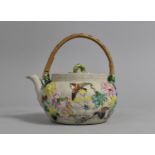 A Yixing Teapot Decorated in Shallow Relief with Multicoloured Enamels Depicting Birds and Flower
