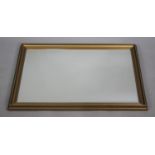 A Modern Gilt Framed Rectangular Wall Mirror, 82x57cms