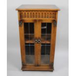 A Glazed Oak Music Cabinet, 54cms Wide