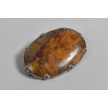 A Polished Oval Agate Brooch, 5.5cms Long